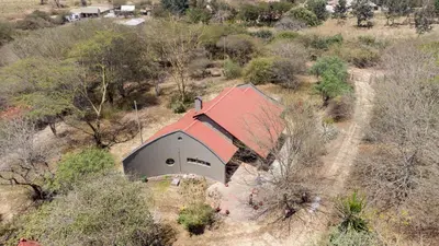 an aerial view of a house with a red roof at GreenNest Ranche in Arusha