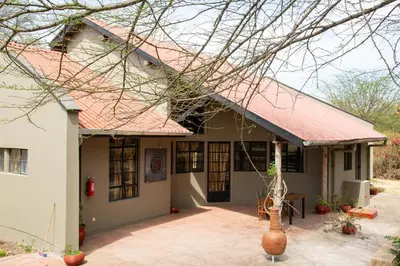 a house with a red roof at GreenNest Ranche in Arusha