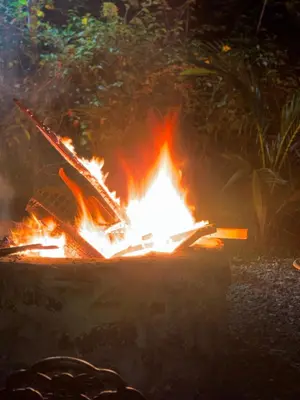 a fire pit with a book on top of it at Oasis Residence in Arusha