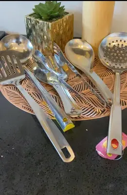 a bunch of utensils sitting on top of a table at Ellys home Arusha in Arusha