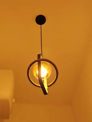 a light hanging from a ceiling in a room at Rest Stop Home in Arusha