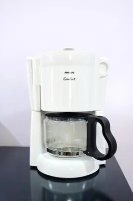 a coffee maker sitting on top of a counter at The Valley Retreat in Arusha