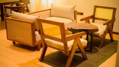 a living room with chairs and a couch and a table at The Valley Retreat in Arusha