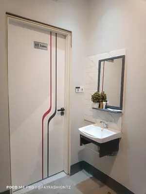 a bathroom with a sink and a mirror at Five Zones - Private 4-Bedroom Holiday Home in Moshi