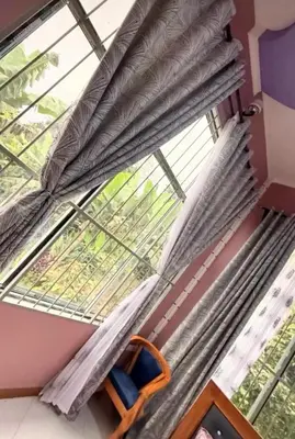 a room with a window with grey curtains at Kilimanjaro Forest Lodge and Camping Site in Mdawi