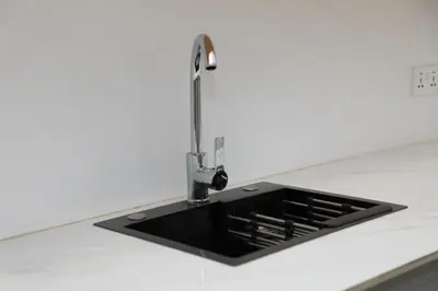 a kitchen sink with a faucet on a counter at Heart Of Africa Lodge Acacia in Mkulat
