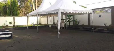 a white tent in front of a building at Safari Haven Villa in Moshi