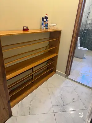 a room with a counter with wooden drawers at Safari Haven Villa in Moshi