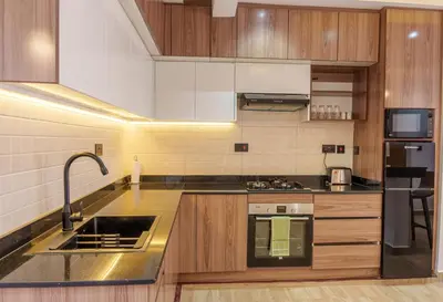 a kitchen with a sink and a counter top at Sereni Homes in Arusha