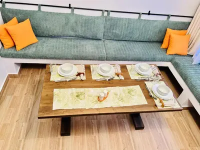 a living room with a couch and a coffee table at Sereni Homes in Arusha