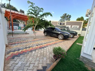 a car parked next to a brick walkway at Kilimanjaro Peponi Villas in Msaranga