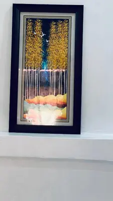 a framed picture of a painting on a wall at Osim Lodge City Centre in Arusha