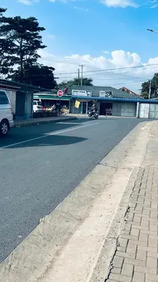 an empty street in front of a building at Osim Lodge City Centre in Arusha