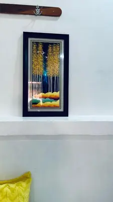 a framed picture on a shelf on a wall at Osim Lodge City Centre in Arusha