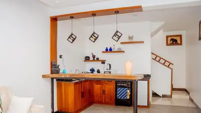 a kitchen with a counter and a sink at AG Comfort Safari Homes in Arusha