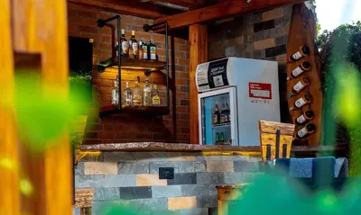 a gas station with a refrigerator and some bottles at AG Comfort Safari Homes in Arusha