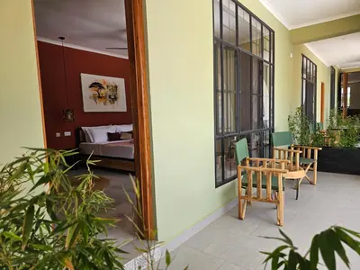 a mirror on the side of a room with a bed at Villa Miamba in Zame