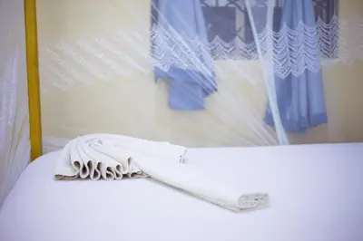 a white hair dryer sitting on top of a table at New Siesta Inn in Nkunjila