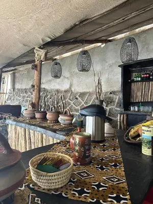 a kitchen with a table with baskets on it at Meru Nest Arusha Bed & Breakfast in Arusha