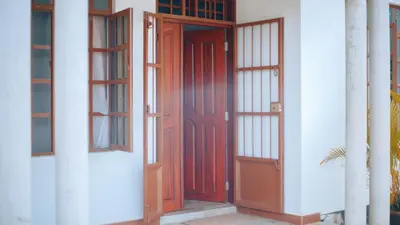 a pair of doors on a white building at Arusha Oasis Executive Residence in Arusha
