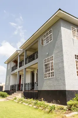 aominium building with a gray at Kitopua suites in Arusha