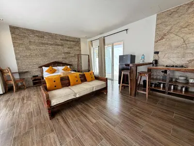 a living room with a couch and a desk at Modern Studio in Njiro, Arusha in Arusha