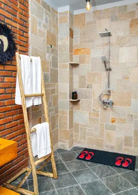 a bathroom with a towel rack and a shower at Zondela House in Nkoanrua