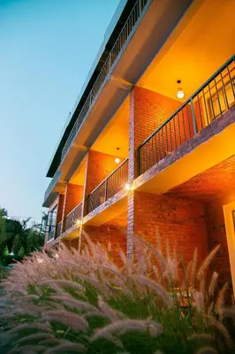 a building with a balcony on the side of it at Zondela House in Nkoanrua