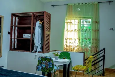 a room with a dressing table and a window at Subira Home in Arusha