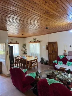 a living room with a couch and a table at Kwetu Homestay Spacious 4BR Home in Moshi