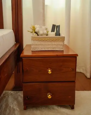 a wooden dresser with a basket on top of it at Cozy Urban home in Arusha
