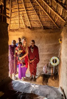 a group of people standing in a room at Ewang'ani Maasai Cultural Village - Overnight Experience and Tour in Sanya Chini Station