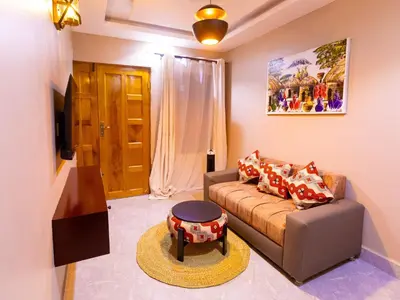 a living room with a couch and a table at Msafiri Haven in Moshi