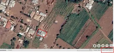 an overhead view of a field with a red building at Kilimanjaro View Retreat in Moshi