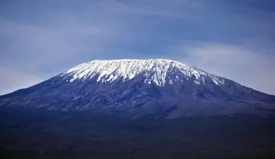 a snow covered mountain on top of a mountain at Kilimanjaro View Retreat in Moshi