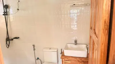 a bathroom with a sink and a toilet at Two rivers lodge in Arusha