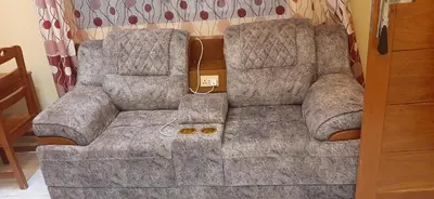 a large couch sitting in a living room at Mbogo Safari Hotel in Karatu