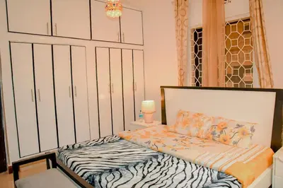 a bedroom with a bed in a room at Kilimanjaro Serenity Lodge & Camp