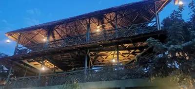 a wooden building with lights on top of it at Camp Kimanganu Safari Lodge in Msaranga