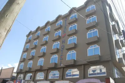 a building with windows on the side of it at Atlas Hotel in Arusha
