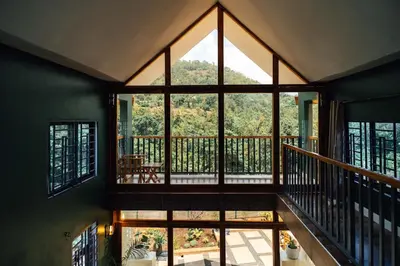 a room with a large window and a balcony at Starico Residence in Nkoanrua