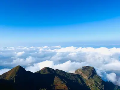 a view of mountains and clouds from above at Shume cliffs in Manga