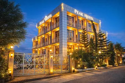 a large building with lights in front of it at Peak Hotel & Safaris in Karatu