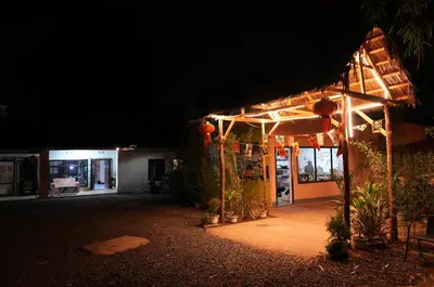 a building lit up at night with lights at Hotel near the clock tower in Arusha