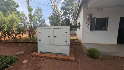 a small white cabinet sitting outside of a house at Dawson's Homestay in Msaranga