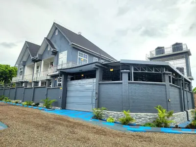 a large house with a garage at Karibu Haven Apartments in Arusha