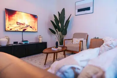 a living room with a couch and a table at LEGIT HOUSE Arusha in Arusha