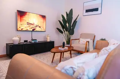 a living room with two couches and a coffee table at LEGIT HOUSE Arusha in Arusha