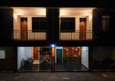 a series of photos of a building at night at Kiliscape Abode in Uru