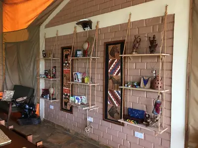 a brick wall with shelves on the wall at Pembeni Rhotia in Karatu